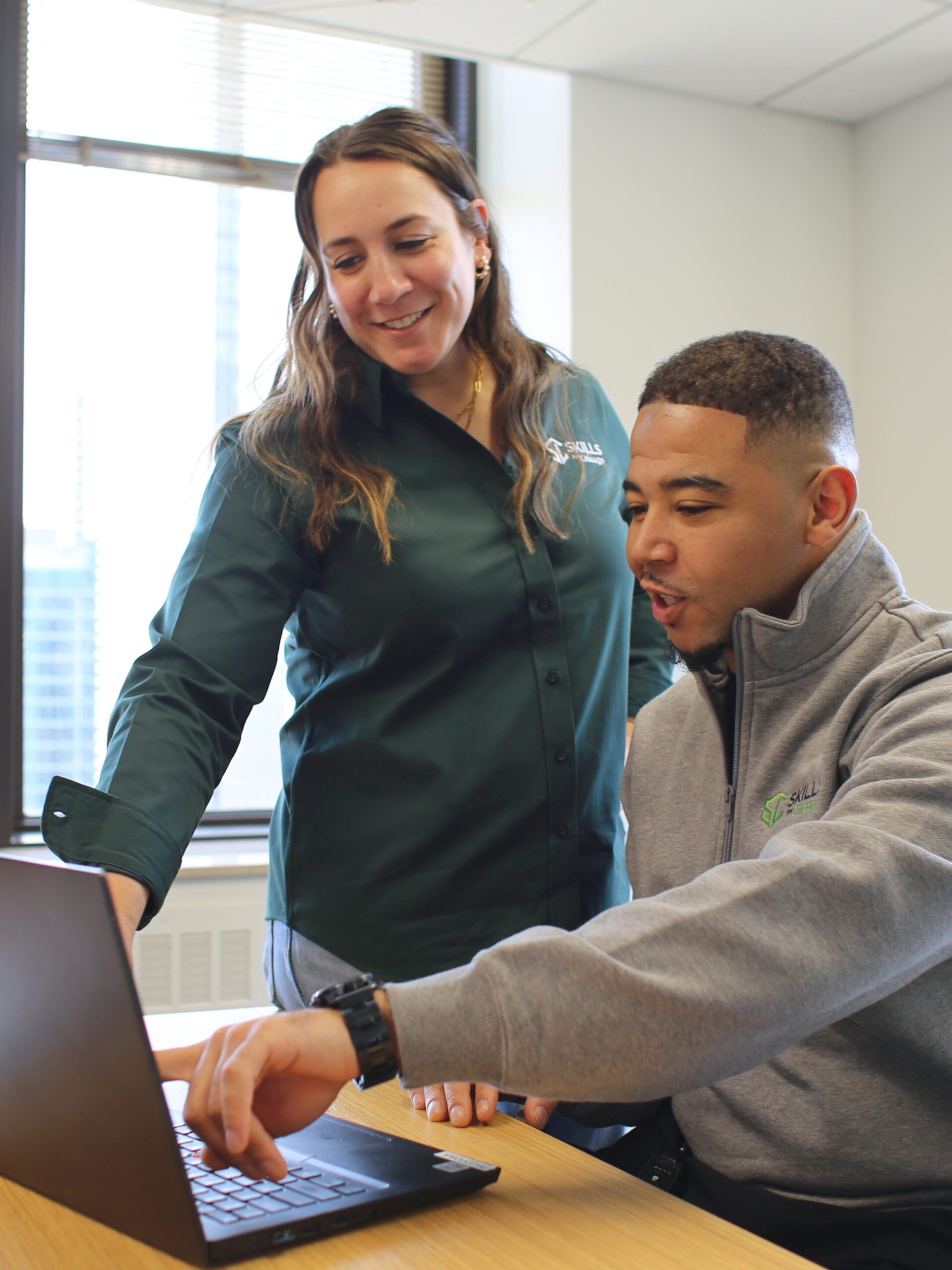 Two people collaborating with tablet